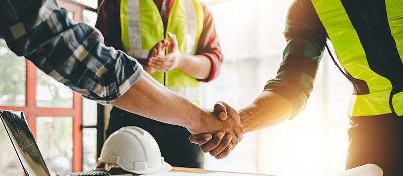 engineering team shaking hands start planning for architecture Engineer sketching construction project concept with architect equipment Consult about their construction project.